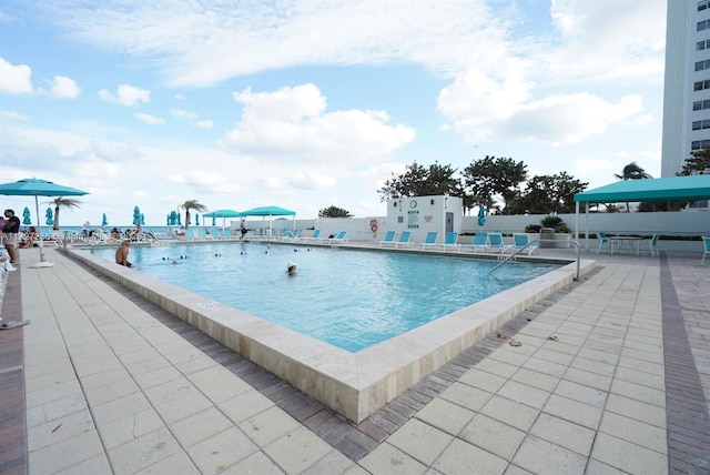 view of swimming pool featuring a patio area