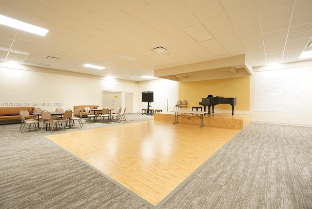 workout area with hardwood / wood-style flooring