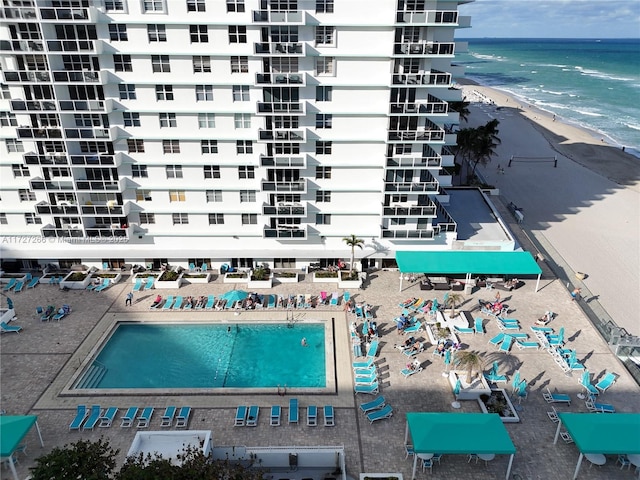 birds eye view of property featuring a view of the beach and a water view