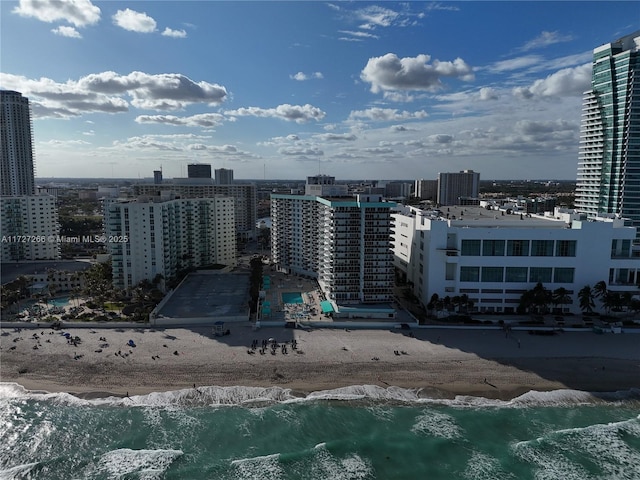 city view featuring a beach view and a water view