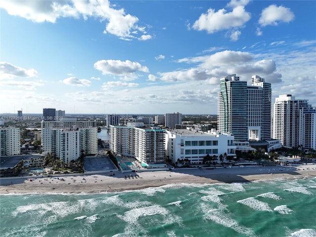 property's view of city featuring a beach view and a water view