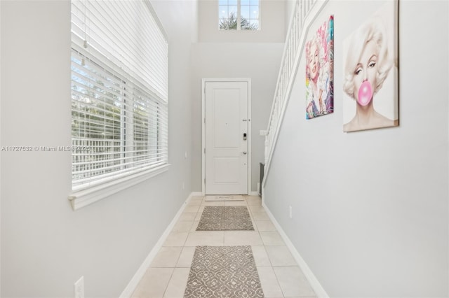 entryway featuring light tile patterned floors and a wealth of natural light