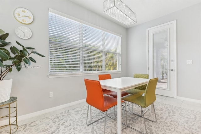 dining area with light tile patterned flooring