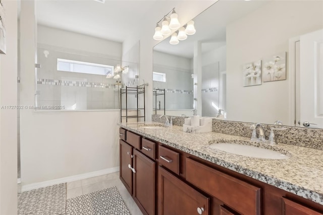 bathroom with vanity, tile patterned floors, a skylight, a chandelier, and a tile shower