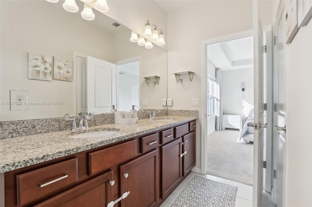 bathroom with tile patterned floors and vanity