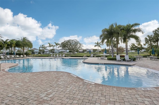 view of swimming pool featuring a patio area