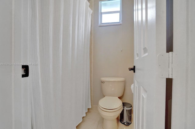 bathroom featuring toilet and tile patterned floors