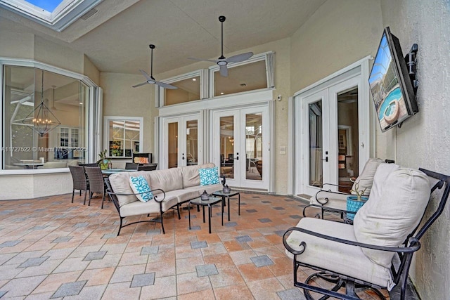 view of patio / terrace featuring ceiling fan, an outdoor hangout area, and french doors