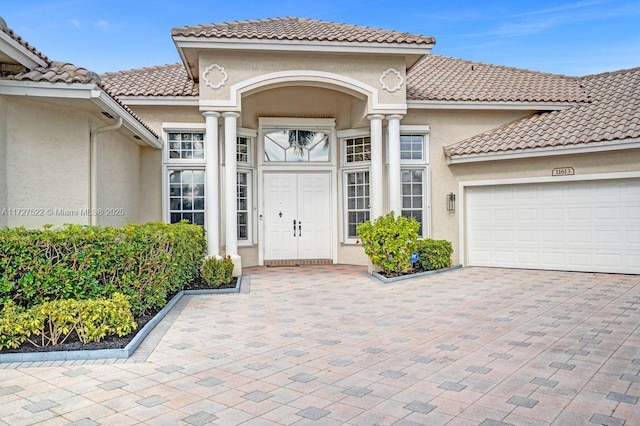 doorway to property featuring a garage