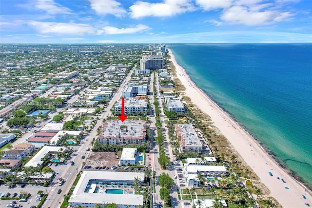 drone / aerial view with a view of the beach and a water view