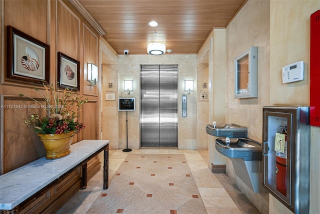 interior space featuring elevator and wooden ceiling