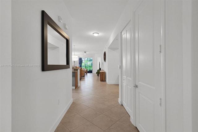 hallway with light tile patterned floors