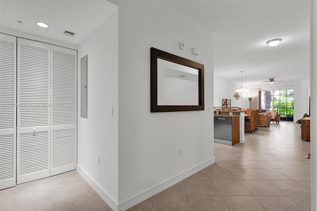 hallway with light tile patterned floors