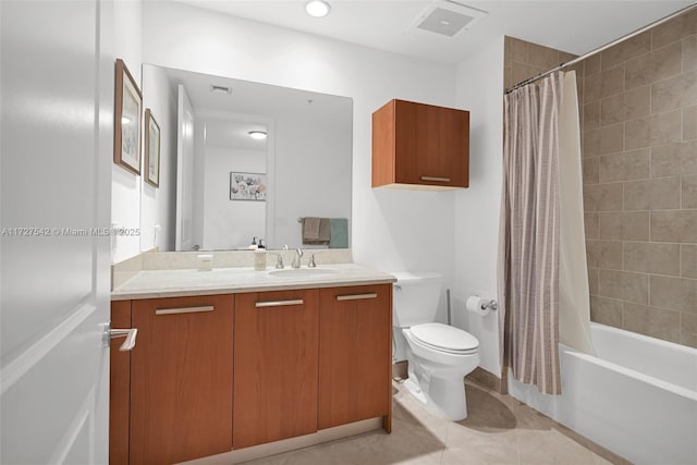 full bathroom with toilet, vanity, tile patterned flooring, and shower / bath combo