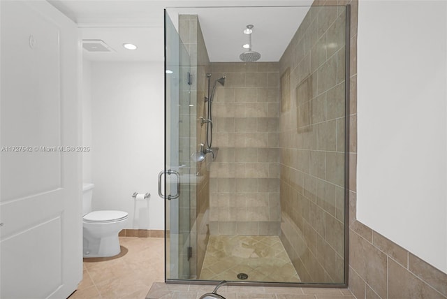 bathroom with toilet, walk in shower, and tile patterned flooring