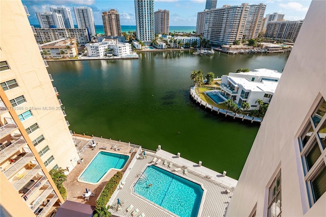 birds eye view of property featuring a water view