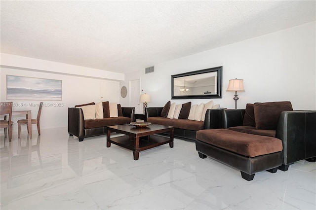 living room featuring a textured ceiling