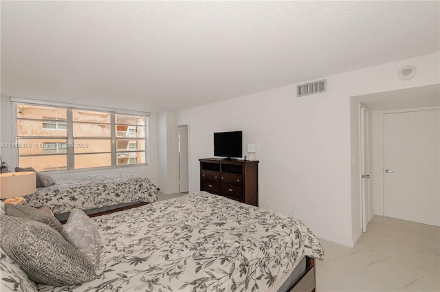 bedroom with a textured ceiling