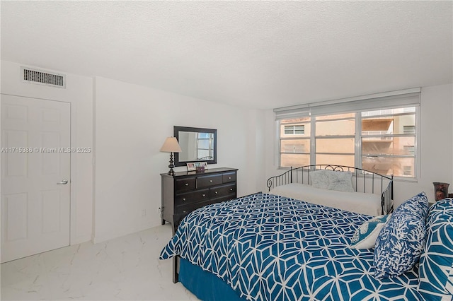 bedroom featuring a textured ceiling