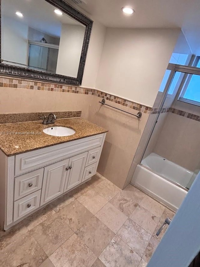 1401 NE Miami Gardens Dr Unit 892, Miami, FL 33179 - bathroom featuring vanity, tile walls, and shower / tub combination