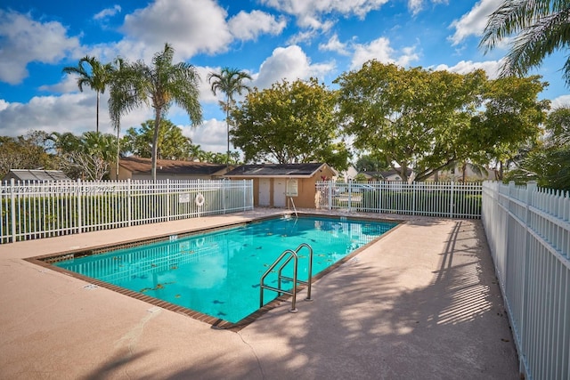 view of swimming pool with a patio area