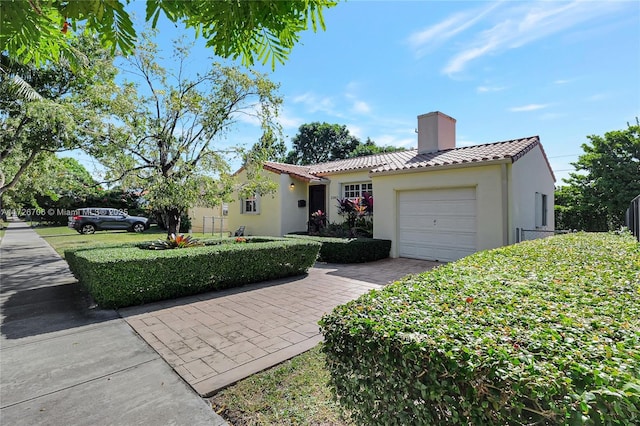 view of front of property with a garage