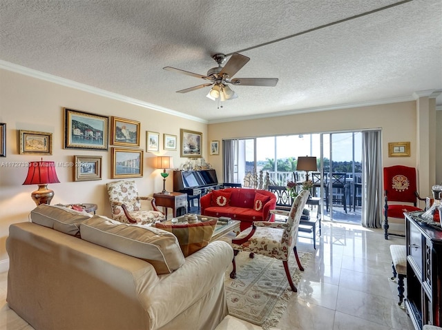 tiled living room with a textured ceiling, ceiling fan, and ornamental molding