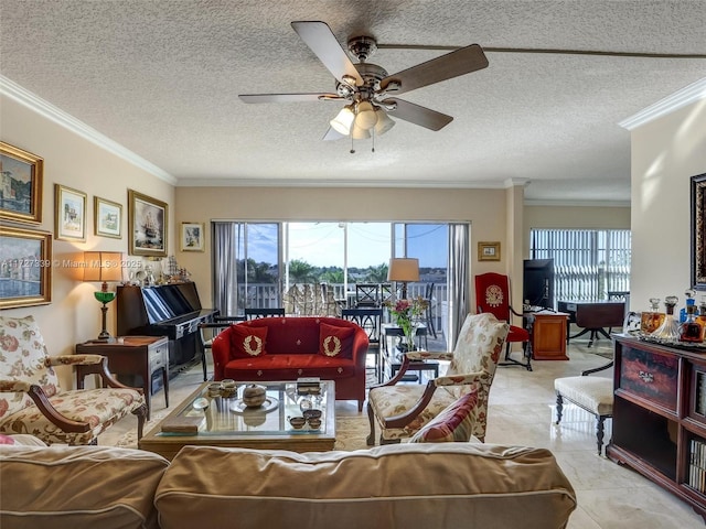 living room with ceiling fan, light tile patterned flooring, a textured ceiling, and ornamental molding