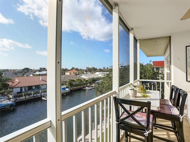 balcony featuring a water view