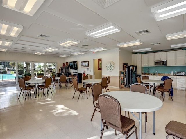 dining space featuring sink