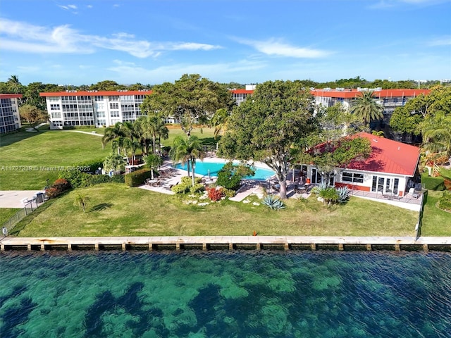 birds eye view of property with a water view