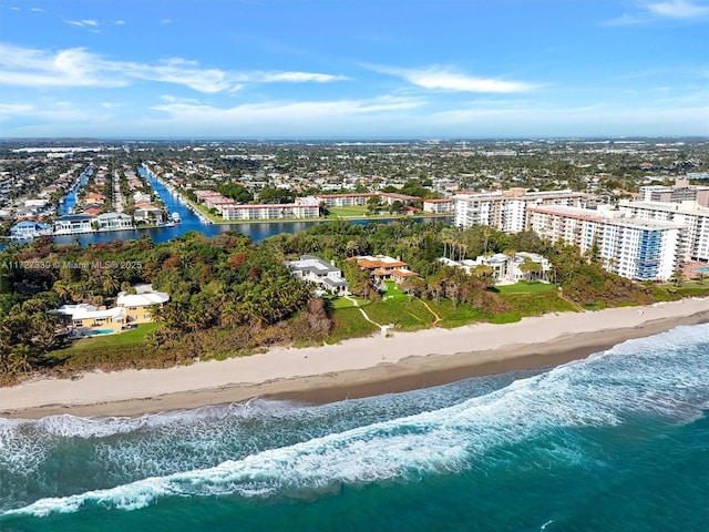 birds eye view of property featuring a water view and a view of the beach