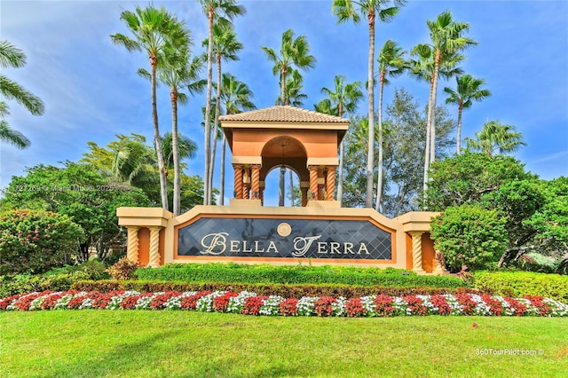 community / neighborhood sign with a lawn