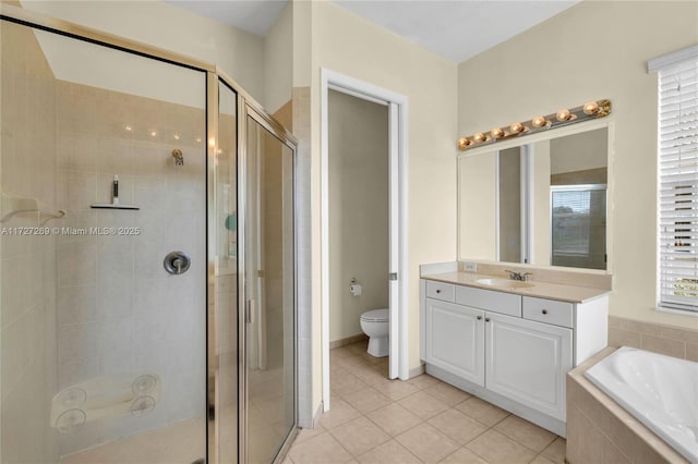 full bathroom featuring toilet, vanity, tile patterned floors, a wealth of natural light, and shower with separate bathtub