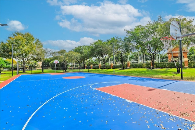 view of basketball court featuring a yard