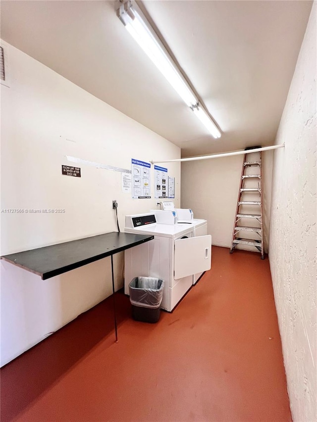 laundry room with washing machine and clothes dryer