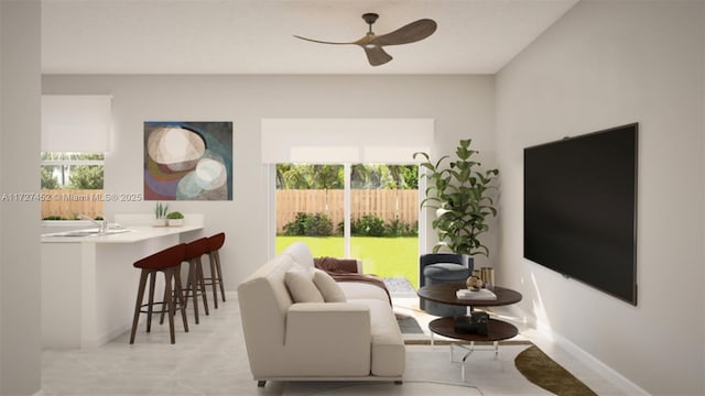 living room featuring ceiling fan and sink