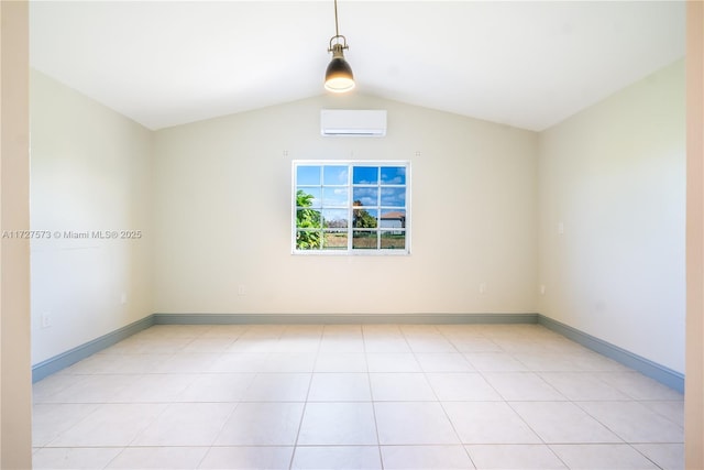 tiled spare room with lofted ceiling and a wall mounted AC