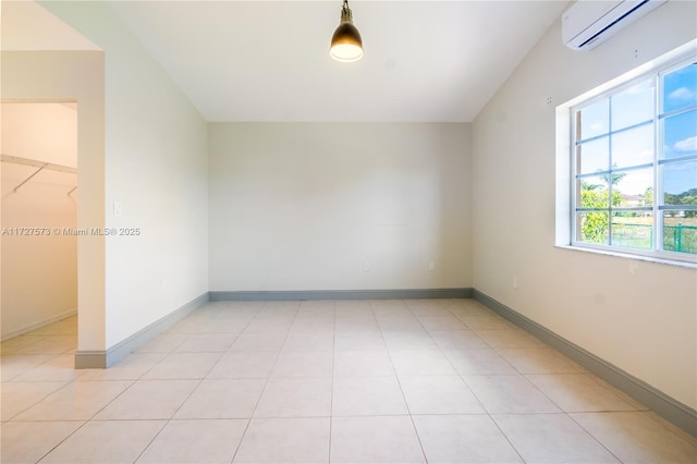 additional living space with light tile patterned flooring and a wall mounted AC