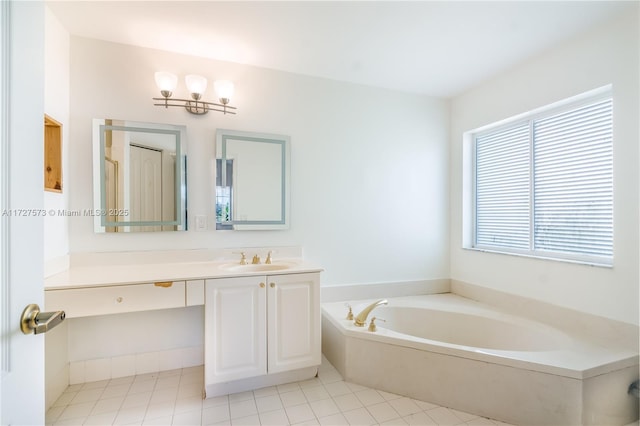 bathroom with a tub to relax in, vanity, and tile patterned flooring