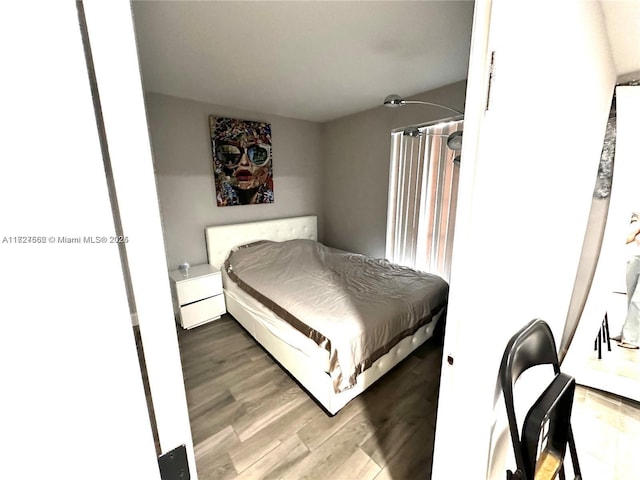 bedroom with wood-type flooring