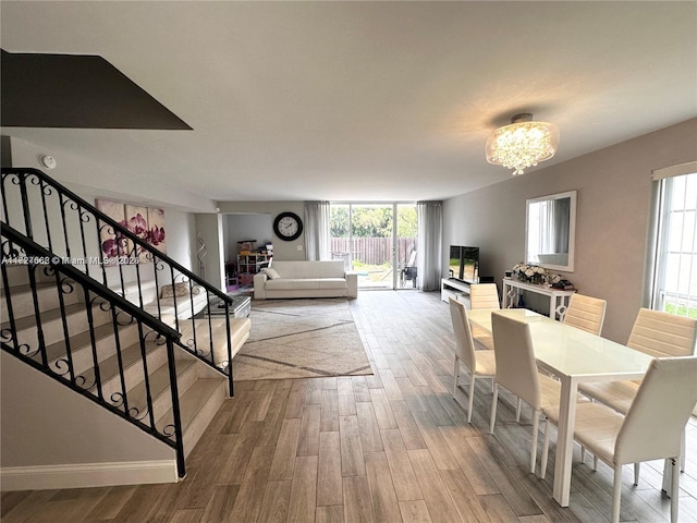 dining room with a chandelier and hardwood / wood-style floors