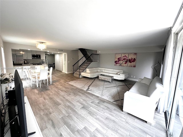 living room with light hardwood / wood-style floors