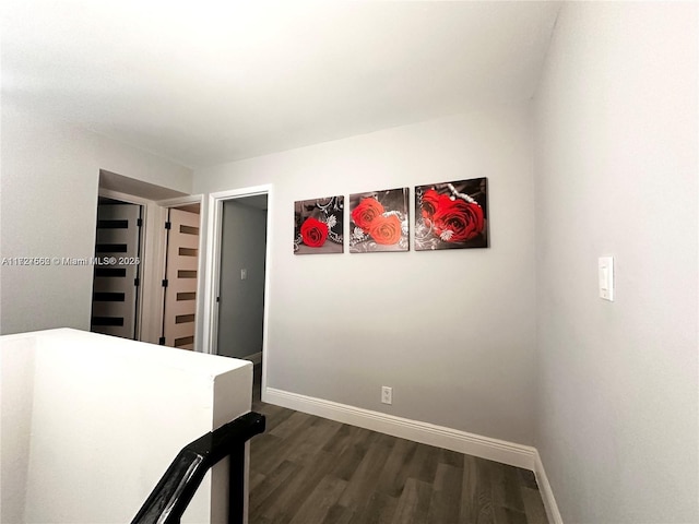 hallway with dark wood-type flooring