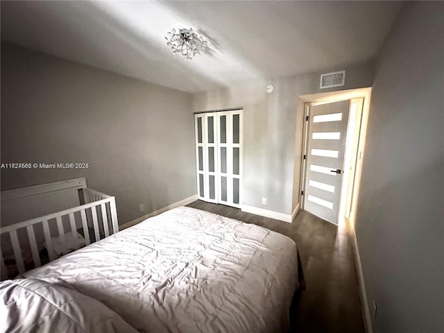 bedroom with dark hardwood / wood-style flooring