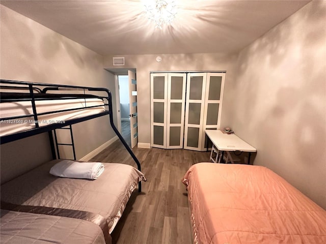 bedroom featuring a closet and wood-type flooring