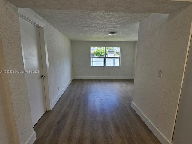 unfurnished room featuring dark hardwood / wood-style flooring