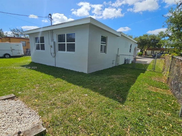 view of home's exterior featuring a yard