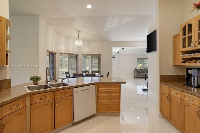 kitchen featuring sink, hanging light fixtures, kitchen peninsula, a notable chandelier, and white dishwasher