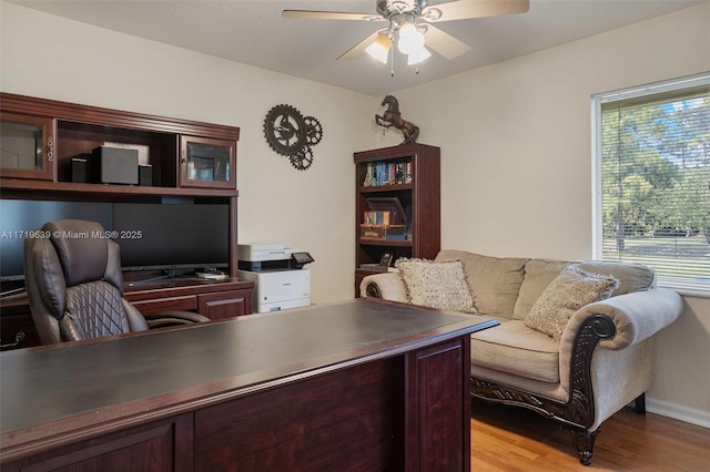 office space featuring light hardwood / wood-style floors and ceiling fan